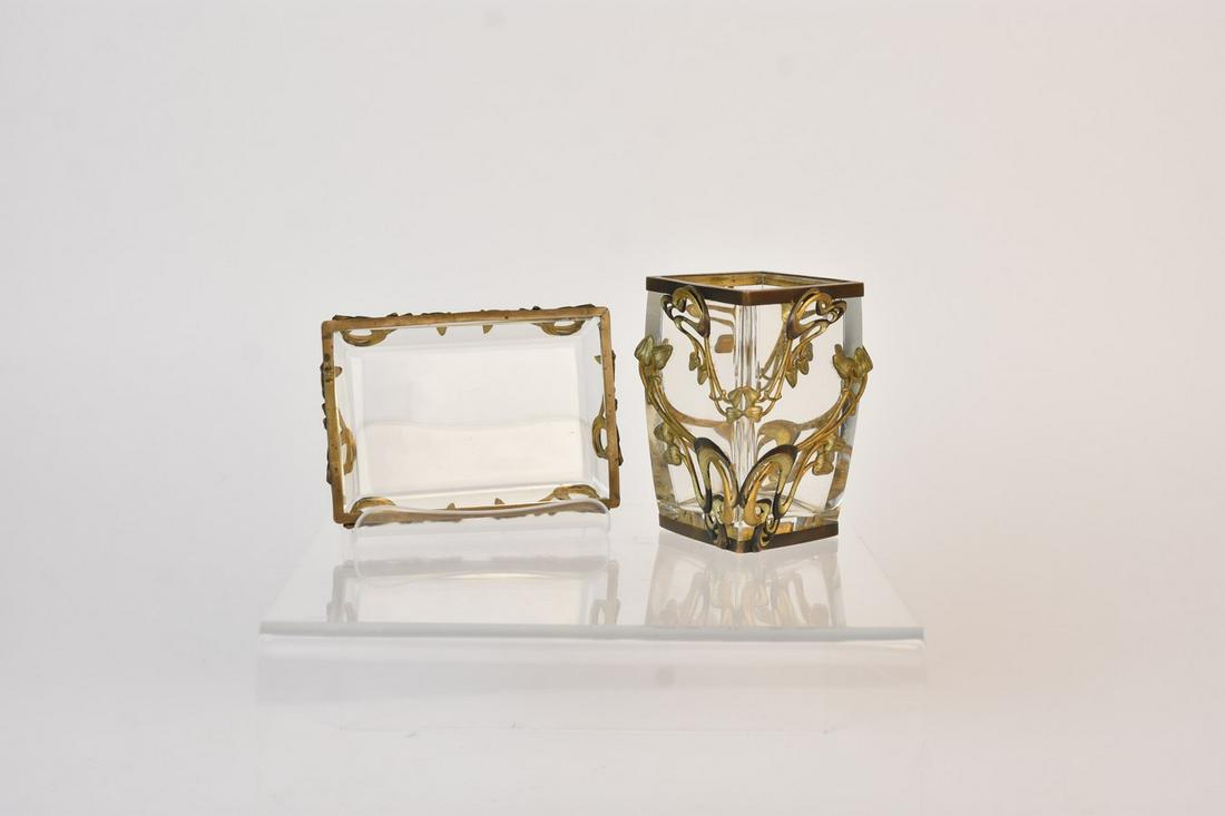 Art Nouveau Glass Vase & Dish with Metal Overlay: A pair of glass items with an Art Nouveau style metal openwork overlay with a gilt finish. The pieces include a small dish and a square vase. The overlay is removable in two pieces on the vase. There 