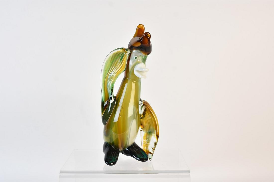 Murano Style Art Glass Penguin: A Murano Style art glass figurine of a penguin. It measures approx. 9.5" H x 3.5" W. Some shelf wear primarily to underside. Please Note: Scheerer McCulloch Auctioneer only ships a limited number of i