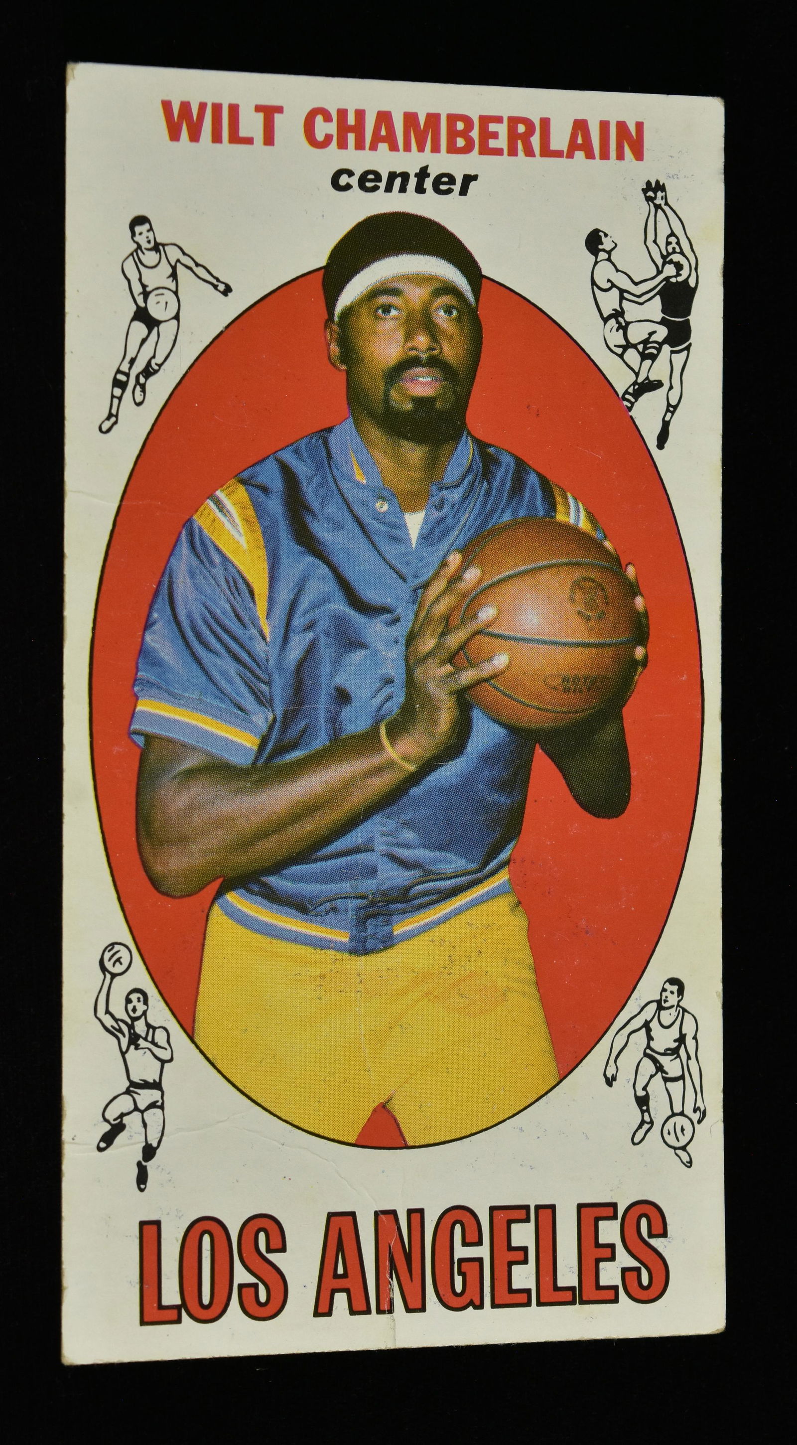 1970 Topps Wilt Chamberlain #1 Basketball Card: 1970 Topps Wilt Chamberlain #1 basketball card. 2 1/2" x 4 11/16". NCAA vintage collectible. Mild corner wear, red pencil number marking on back of card, creasing. Please Note: Scheerer McCulloch Auct