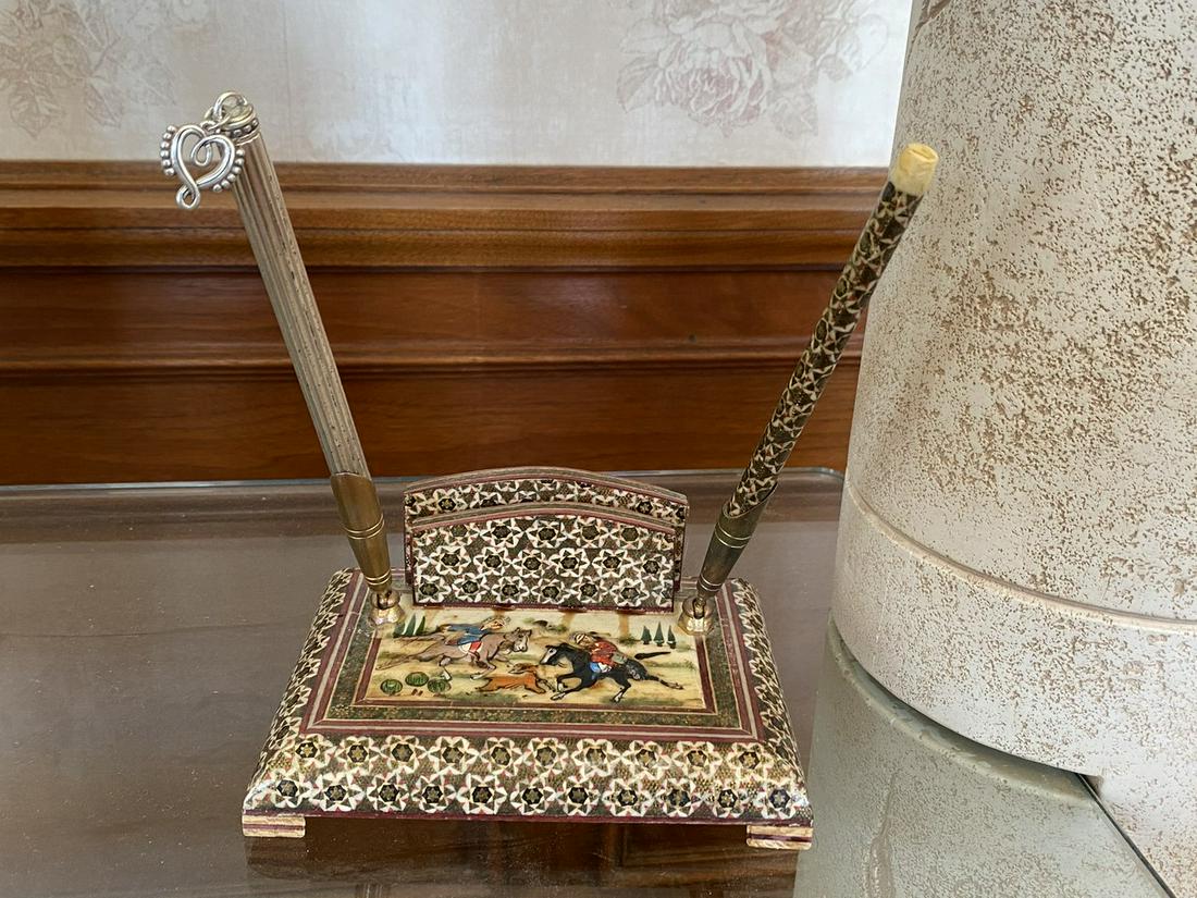 Persian Bone Inlaid Pen Set: An inlaid Persian pen set with two pen holders and a slot for scratch paper. Measures approx. 2.5" H x 6" W x 4.5" D w/o pen. Light discoloration. Please Note: Scheerer McCulloch Auctioneer only ships