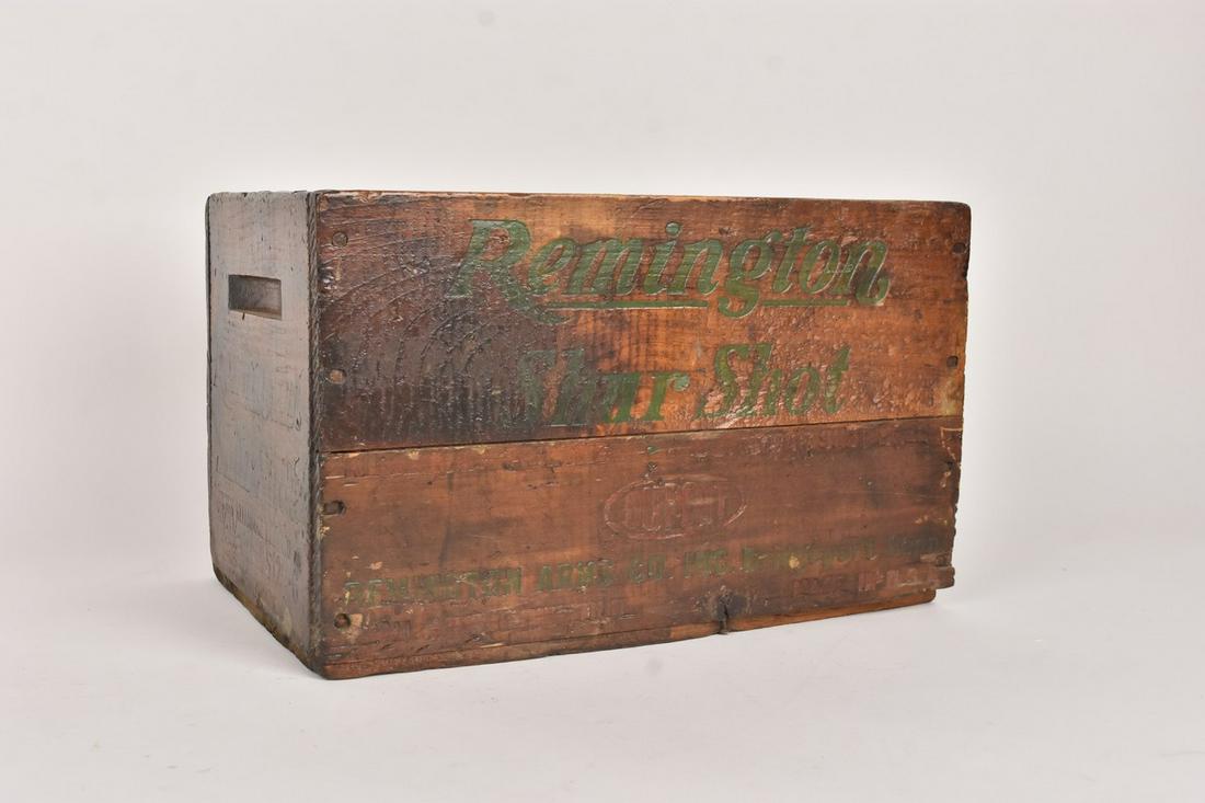 Remington Shur Shot Wood Crate: A wood crate marked Remington Shur Shot to its sides in black. Measures approx. 9" H x 9.5" D x 14.5" D. Surface wear and chips; discoloration. Please Note: Scheerer McCulloch Auctioneer only ships a 