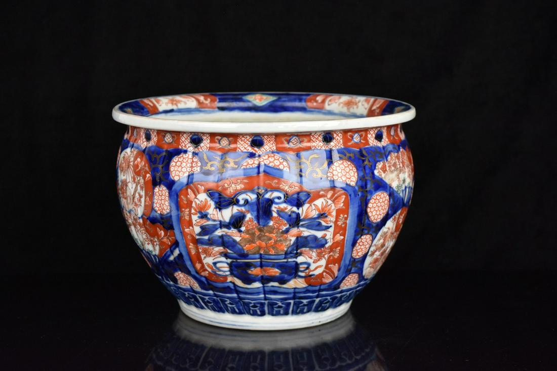 Antique Japanese Imari Planter: An antique Japanese Imari porcelain planter featuring vibrant hand-painted detailing. Measures approx. 6.5" H x 9" in diameter. Condition consistent with age and use. Please Note: Scheerer McCulloch A