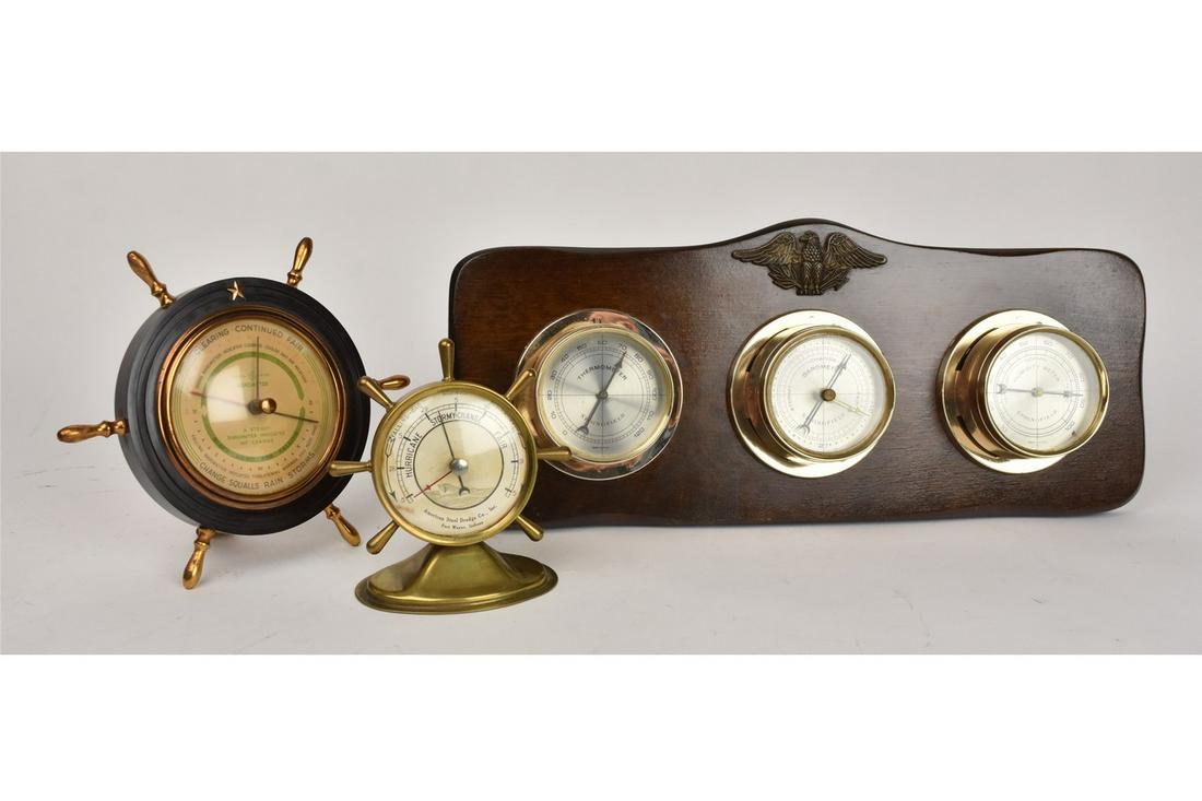 Weather Insturments Incl. Barometers: A trio of weather tracking insturments including a General Electric brand barometer in a ship's wheel case. Also included is an American Steel Dredge Co. of Fort Wayne ship's wheel barometer; and a tr