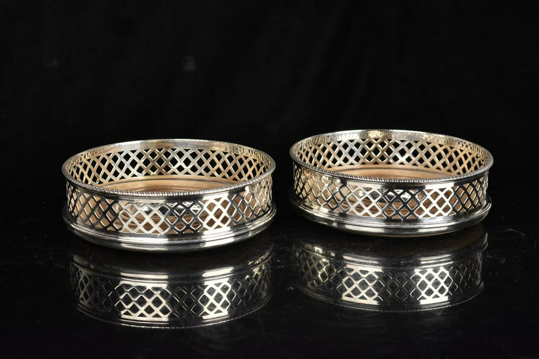 George III Sterling & Wood Wine Coasters: A pair of late 18th-early 19th century wine coasters comprised of sterling silver and wood. They feature openwork sides with a wood interior. Hallmarked to their sides "WA" likely for William Allen II