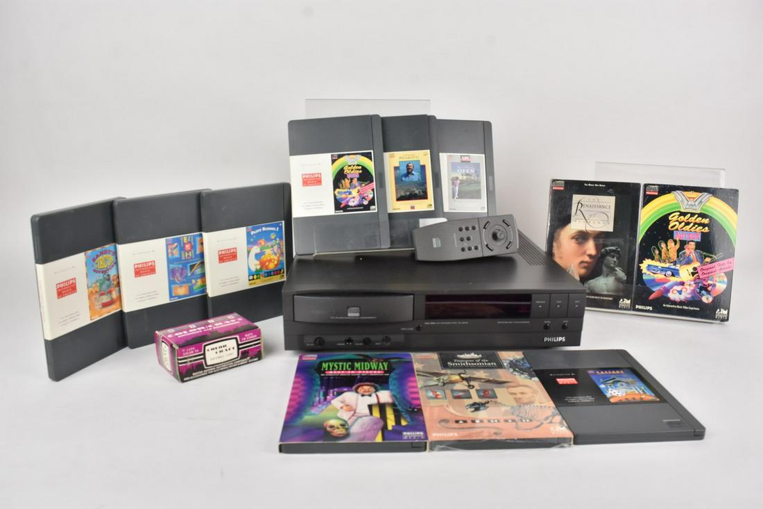 Philips CD-Interactive Player & Discs: A Philips CDI 990 Interactive Player w/ discs. Includes Mystic Midway, The Renaissance of Florence, Treasures of the Smithsonian, The Palm Springs Open, Caesars World of Gambling, and more. Player and