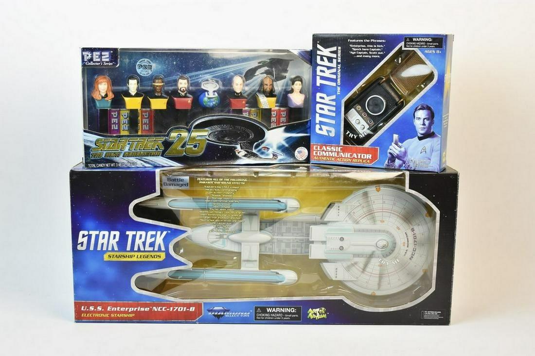 Star Trek Memorabilia Incl. Pez: A trio of Star Trek collectibles. Includes The U. S. S. Enterprise Electronic Starship and Classic Communicator produced by Diamond Select Toys; and a 25th Anniversary Star Trek the Next Generation Pe