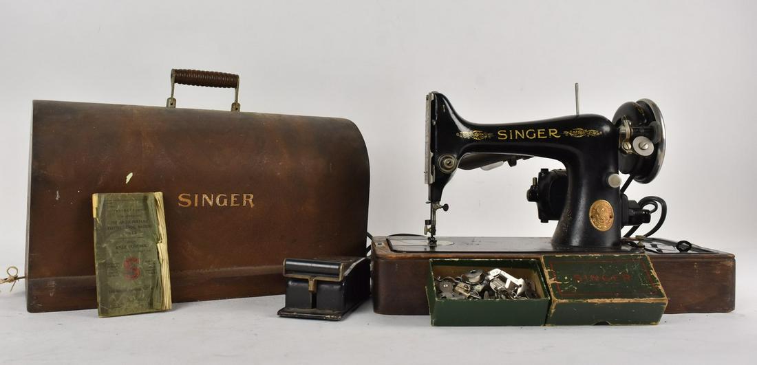 1928 Singer #99 Sewing Machine w/ Case: A 1929 Singer model #99 sewing machine w/ original case; serial number: AC 051632. Includes light attachment, peddle, and original owner's manual. Powered on but otherwise untested; surface scratches
