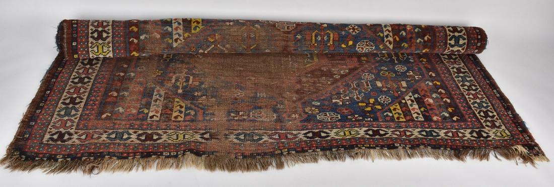 Antique Oushak Style Rug, 5: An antique handwoven Oushak style area rug measuring approx. 5' x 6'. The rug features cream colored fringe and is presented in a palette of crimson, royal blue, mustard, and beige. Fair condition- st