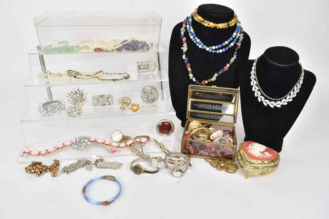 Costume Jewlery Incl. Watches: A lot of costume jewelry including Trifari, 1928, Avon, and Monet. Includes necklaces, pendants, bracelets, earrings, and rings. Also includes jewelry box and music box with cameo on top. Watches incl
