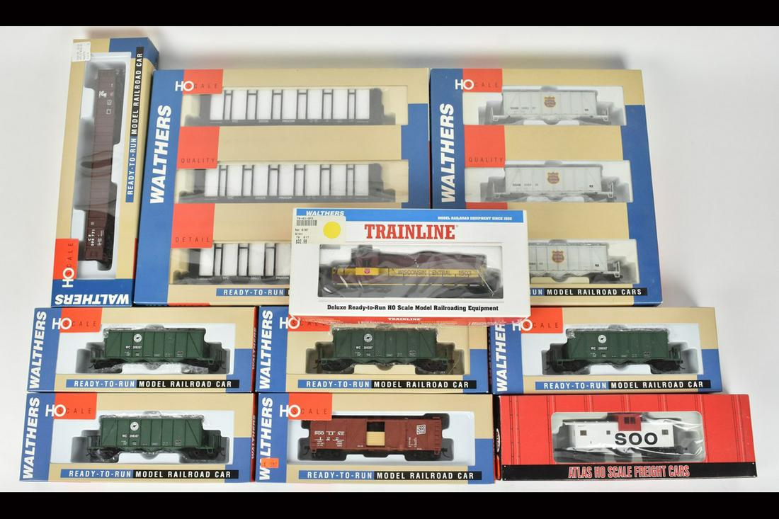 (10) Walthers & Atlas HO Scale Train Cars: A collection of ten Walthers Ready-to-Run and one Atlas train cars in their original packaging; all of which are HO scale. Includes an Extended Vision Soo Line Caboose; a Pulpwood Car 3-Pak; four 40' 