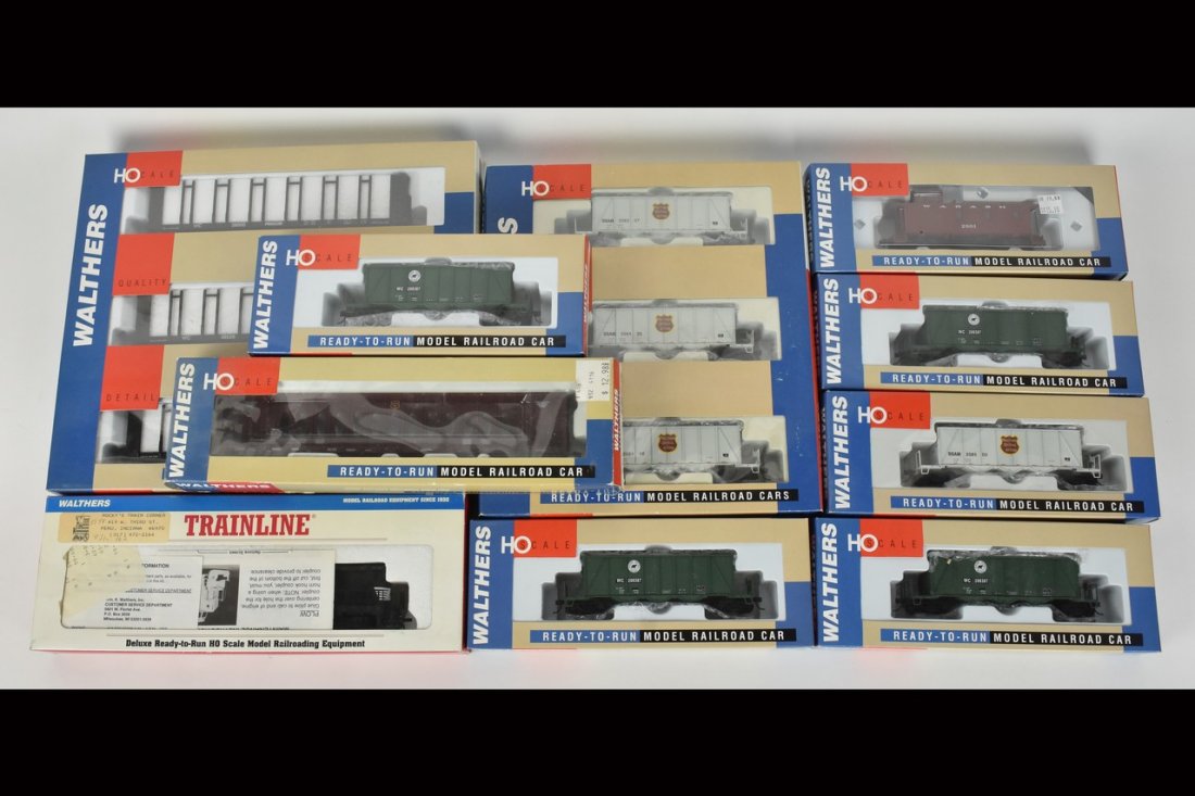 (10) Walthers HO Scale Train Cars: A collection of ten Walthers Ready-to-Run HO scale train cars in their original packaging. Includes a Pulpwood Car 3-Pak; an Ortner Aggregate 3-Pak; four individual Ortner Aggregate cars; a Wood Caboo