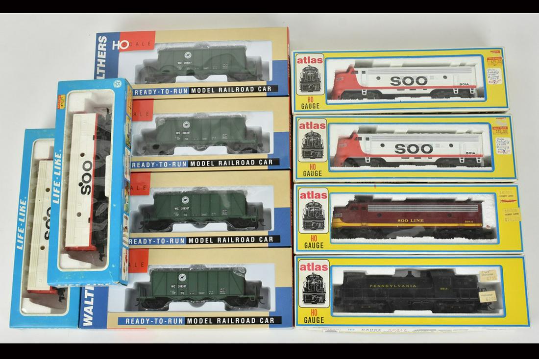 (10) Atlas, Walthers & Life-Like HO Train Cars/Eng: A collection of ten train cars/engines featuring Life-Like, Atlas, and Walthers. Includes a Pennsylvania RS-1 Diesel; a Soo Line FP 7 Diesel, Ortner Aggregate Cars; and more. Shelf wear to packaging; 