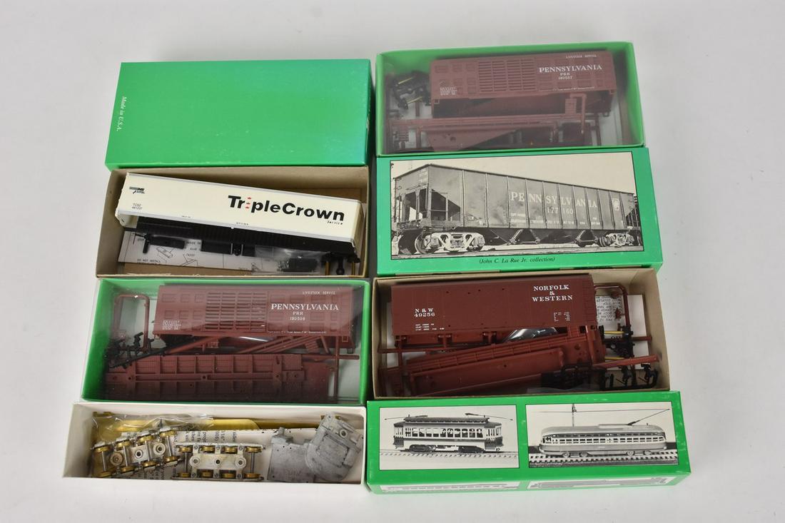(5) Bowser HO Scale Train Model Kits: A collection of five Bowser HO scale model kits in original packaging including K-11 Stock Cars; a Double Door Round Roof Box Car; and more. Some kits may be assembled/partially assembled; contents of