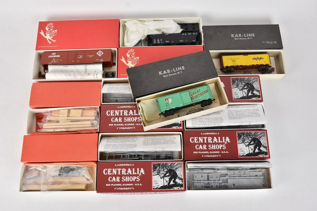 (10) HO Scale Model Train Kits: A collection of ten model train kits in original packaging featuring Centralia Car Shops; Kar-Line; Red Ball; and Robin's Rails Inc. Includes cabooses; box cars; covered hopper; and more. Kits may be