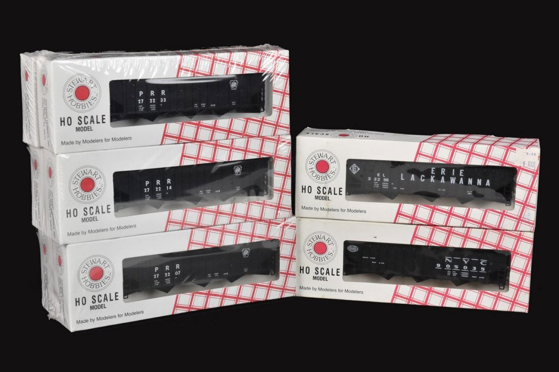 (8) Stewart Hobbies HO Scale Model Trains: A collection of eight Stewart Hobbies HO scale model train kits in original packaging. Includes Pennsylvania, New York Central, and Eries Lackawanna Triple Hoppers. 6 are sealed; other boxes not check