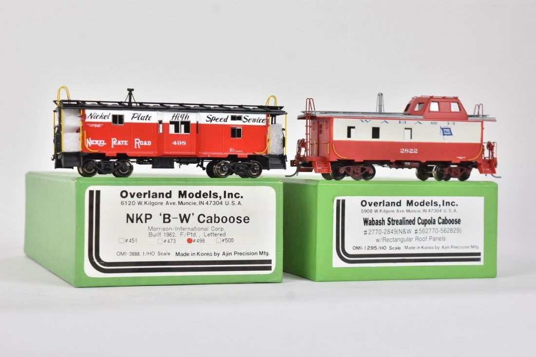 (2) Overland Models by AJIN (Korea): A pair of HO scale Overland Models by AJIN (Korea) trains in their original packaging; still wrapped in plastic. Includes Wabash Streamlined Cupola Caboose and NKP 'B-W' Caboose. Light shelf wear to p