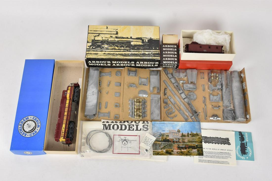HO Scale Model Trains Incl. LMB: A trio of model trains or model train kits in original packaging. Includes LMB Models NYC Wood Caboose; The Bethlehem Car Works Pennsylvania Railway Post Office; and Arbour Models J1 2-10-4 loco. Shel