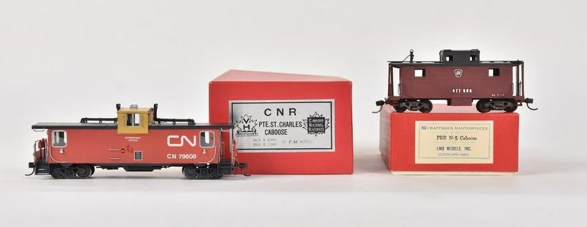 (2) HO Scale Cabooses Incl. VH: A pair of HO scale train models in original packaging. Includes a VH Scale Models by F. M. Models Korean CNR Pte. St. Charles Caboose; and a LMB Models PRR N-5 Caboose. Light shelf wear to packaging. 