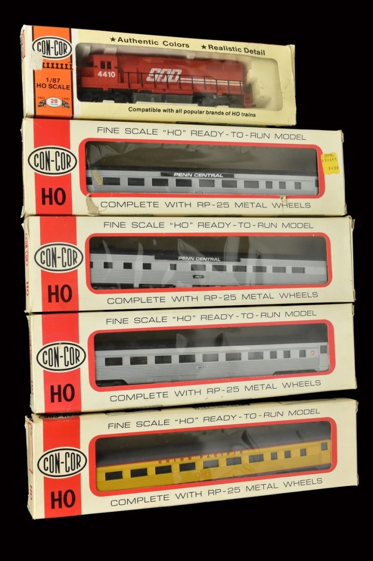 (5) Con-Cor HO Scale Train Cars: A collection of five Con-Cor train cars in original packaging. Includes EMD GP38 Soo Line diesel engine; coach cars; and dining car. Shelf wear and damage to packaging. Please Note: Scheerer McCulloch