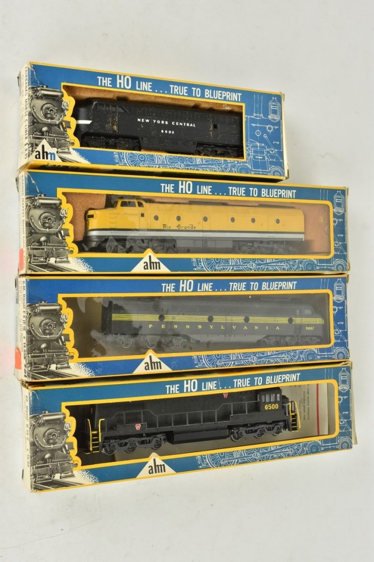 (4) Ahm HO Scale Diesel Engines: A collection of four HO scale Ahm diesel engines in original packaging. Includes Fairbanks Morse C-Liner; Krauss Maffel Diesel; GE Diesel U 25 C; and G. M. Diesel E8 (E9). Heavy wear and tear to packa