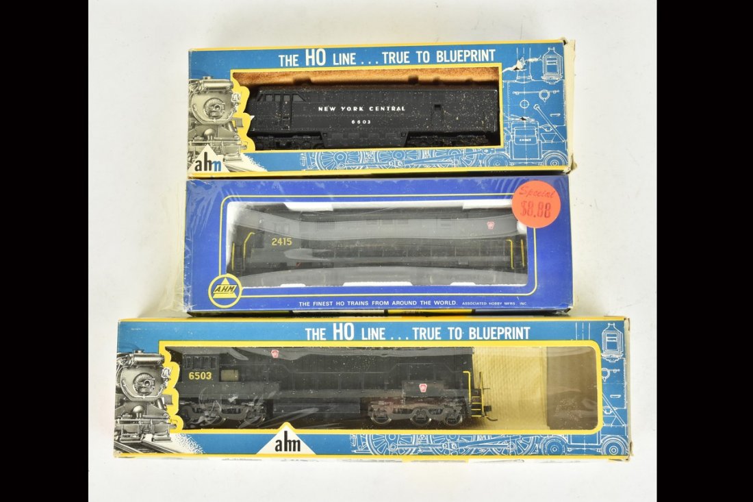 (3) Ahm HO Scale Diesel Engines: A collection of three HO scale Ahm diesel engines in original packaging. Includes Alco Century 424; Fairbanks Morse C-Liner; and GE Diesel U25C. Heavy wear and tear to packaging; retail stickers. Plea