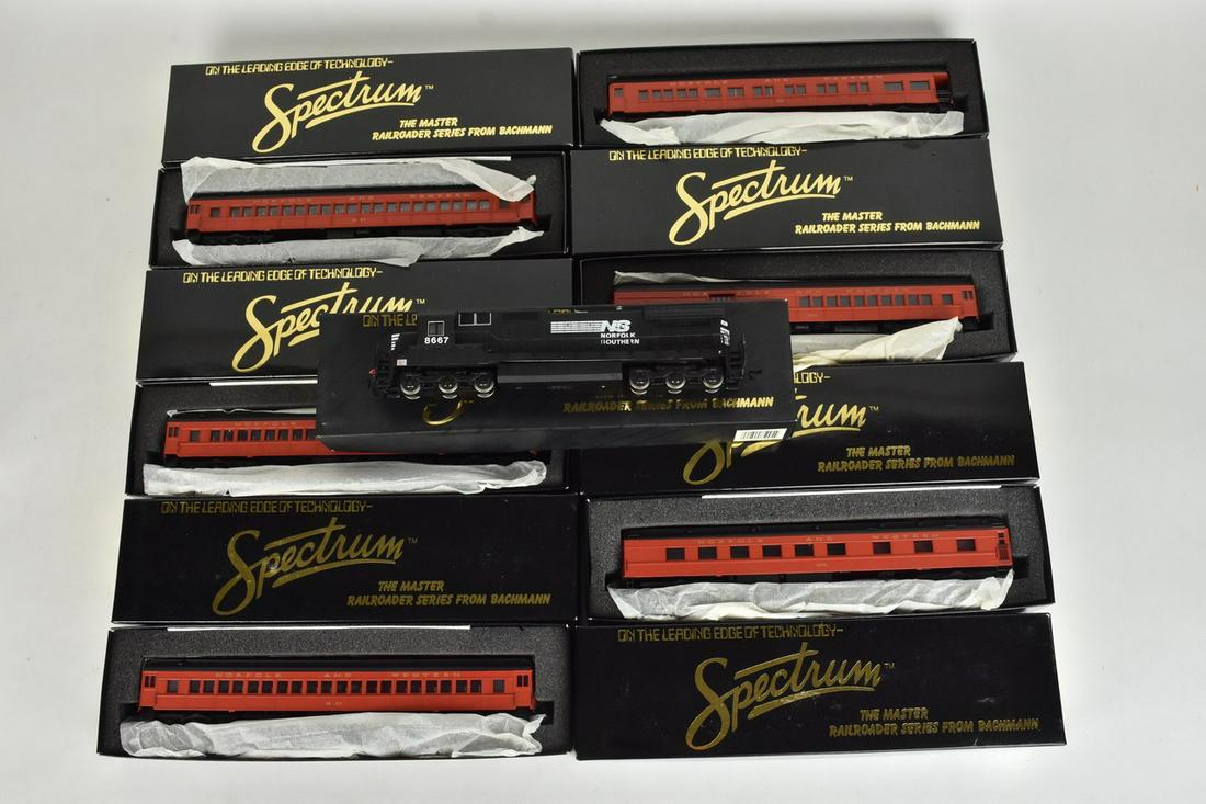 (7) Bachmann Spectrum HO Scale Trains: A collection of seven Bachmann Spectrum HO scale trains in original packaging. Includes passenger cars and a Dash 8 40C diesel engine. Light shelf wear to packaging; some retail stickers present. Plea