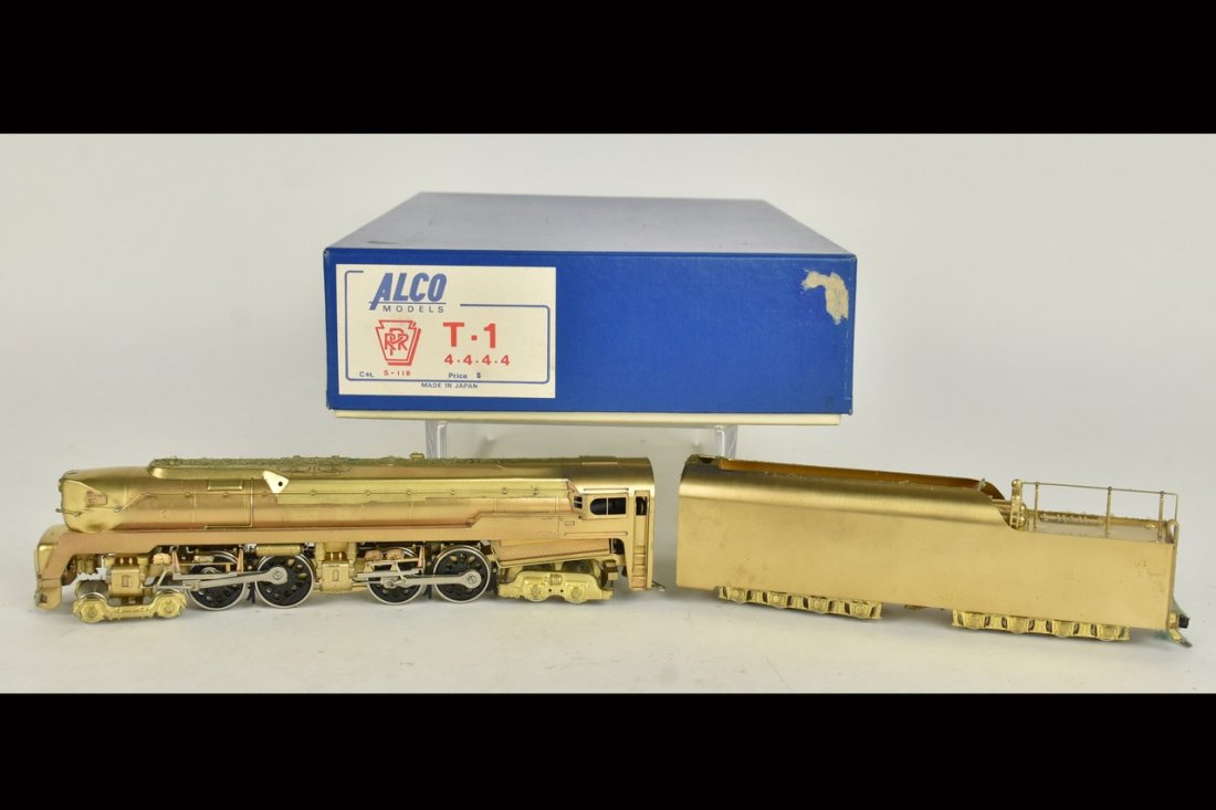Alco Brass HO Scale T-1: An HO scale Alco brass T-1 4-4-4-4 locomotive. In original packaging with light shelf wear; some discoloration. Please Note: Scheerer McCulloch Auctioneer will add shipping charges 1-2 business days a