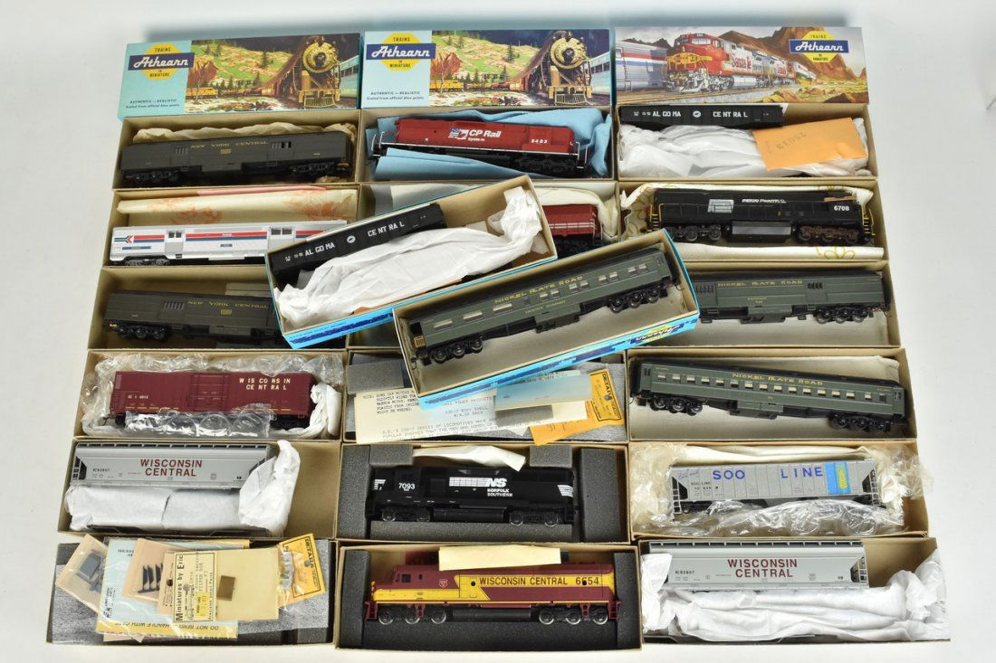 (20) Athearn HO Scale Train Cars: A collection of 20 Athearn HO scale model train kits in original packaging, most assembled. Includes a GP50 Pwr Norfolk Southern; F45 Power Wisconsin Central; U28C Pwr Penn Central; and other train ca