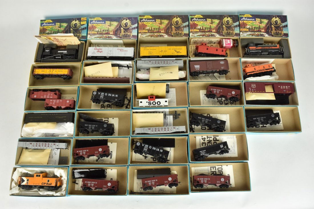 (28) Athearn HO Scale Train Cars: A collection of 28 Athearn HO scale model train kits in original packaging, most assembled. Some boxes include store labels/handwritten labels over the Athearn label; light shelf wear to packaging; ha