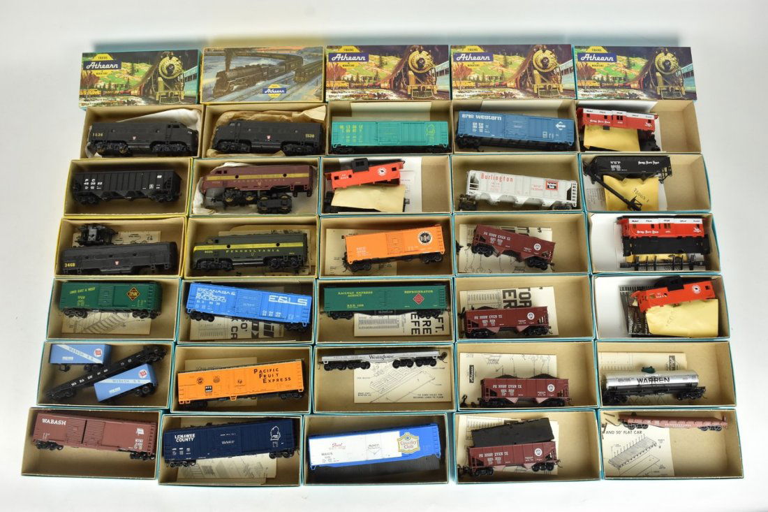 (30) Athearn HO Scale Train Cars: A collection of 30 Athearn HO scale model train kits in original packaging, most assembled. Some boxes include store labels/handwritten labels over the Athearn label; light shelf wear to packaging; ha