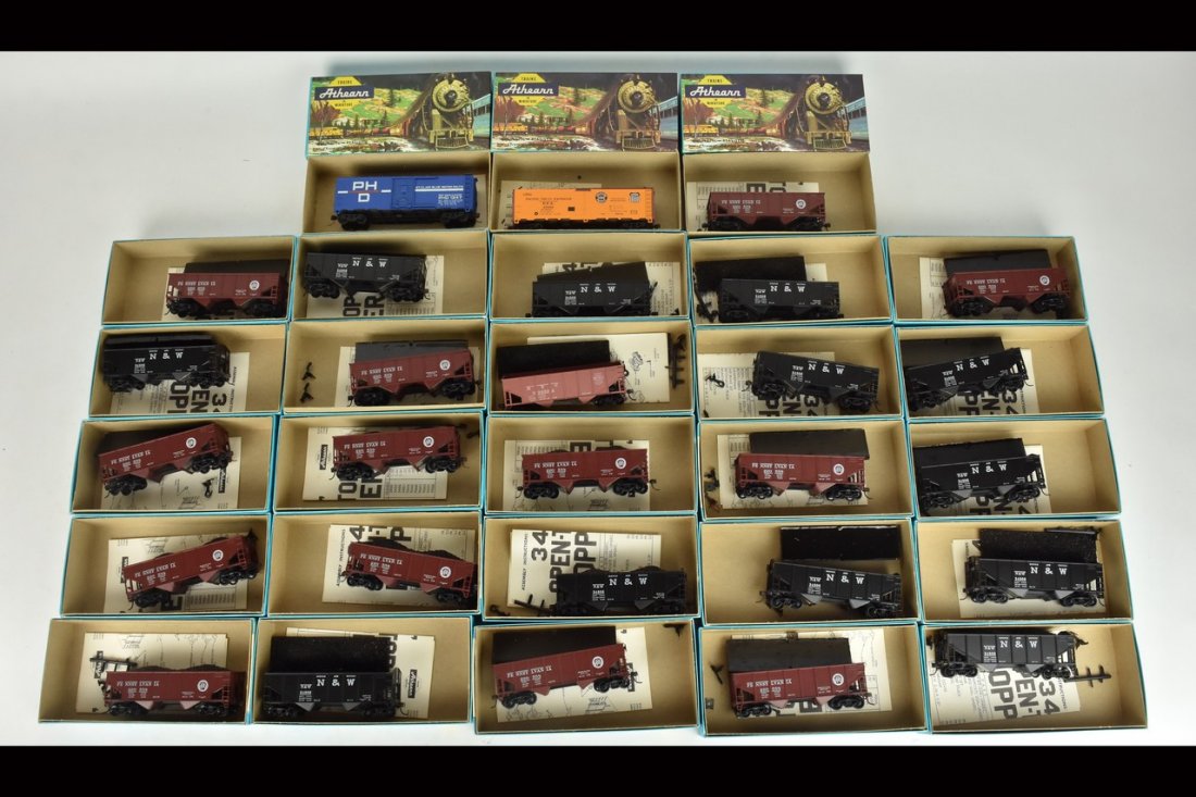 (28) Athearn HO Scale Train Cars: A collection of 28 Athearn HO scale model train kits in original packaging, most assembled. Light shelf wear to packaging; handwriting. Please Note: Scheerer McCulloch Auctioneer will add shipping cha