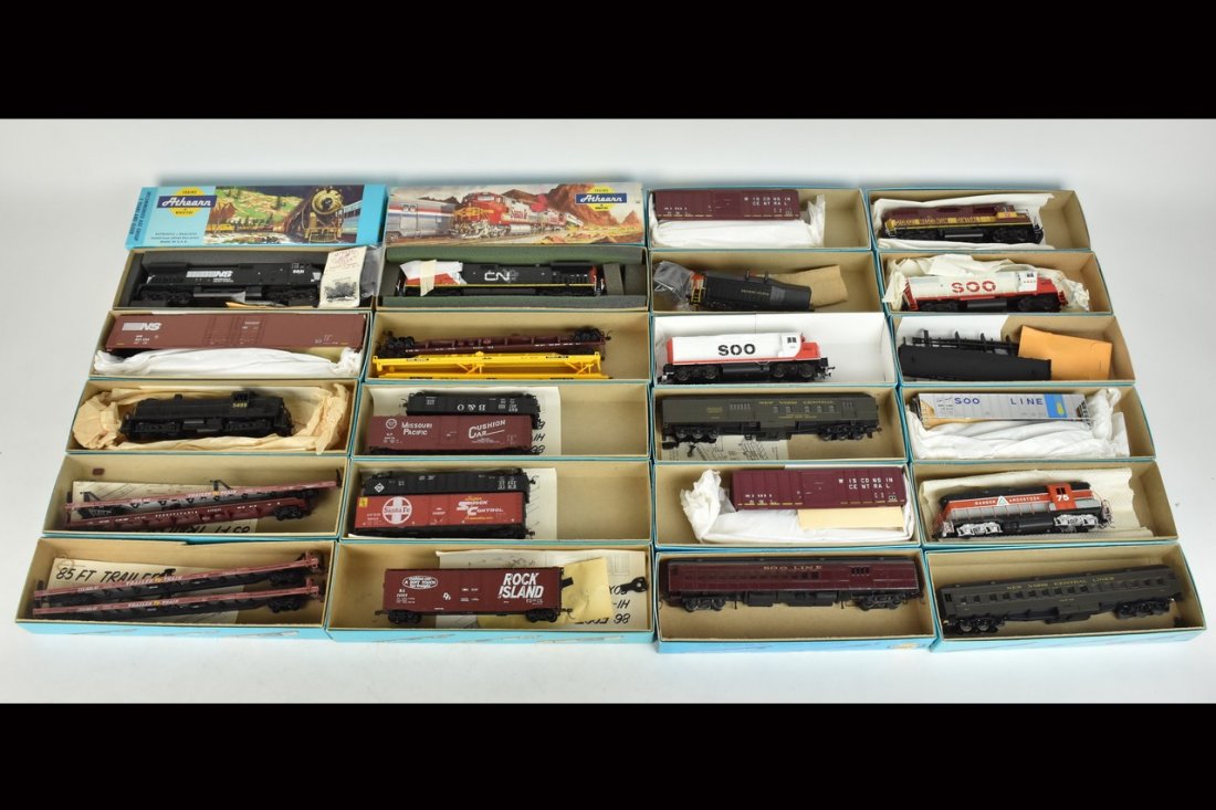 (22) Athearn HO Scale Train Cars: A collection of 22 Athearn HO scale model train kits in original packaging, most assembled. Some boxes include store labels/handwritten labels over the Athearn label; light shelf wear to packaging; ha