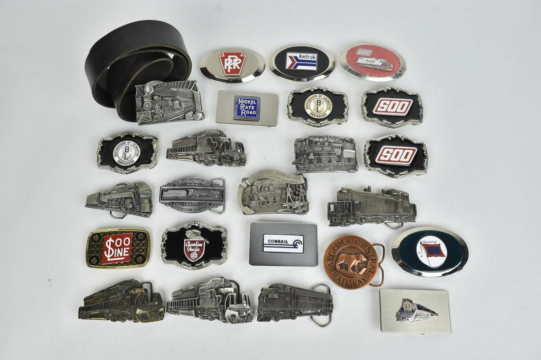 Railroad Belt Buckle Collection: A collection of over 20 railroad themed belt buckles. Includes Brotherhood of Locomotive Engineers; Conrail; Nickel Plate Road; Algoma Central; and more. Condition varies- some discoloration and surfa