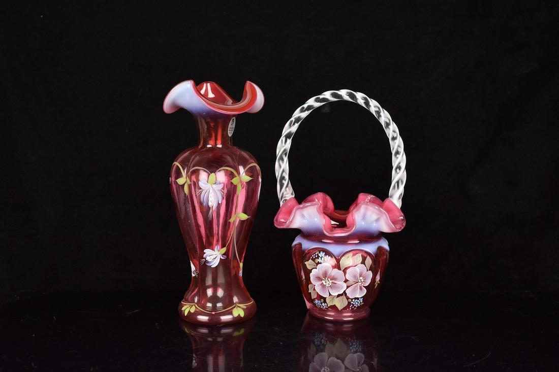 (2) Fenton Cranberry: (1) 9" Fenton "Open Heart Arches" basket with twist clear and white handle. Hand painted. Excellent condition with stamp on base. (1) 9" squared melon vase. Hand painted. Excellent condition, with tag