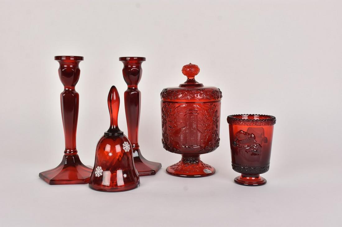 (5) Fenton Ruby Red Glass: (1)8.5" Fenton ruby red glass covered candy dish. Embossed with a church and floral detail. Excellent condition, with tags. (1)6.75" musical bell. Decorated with snow flakes and holding a music box in