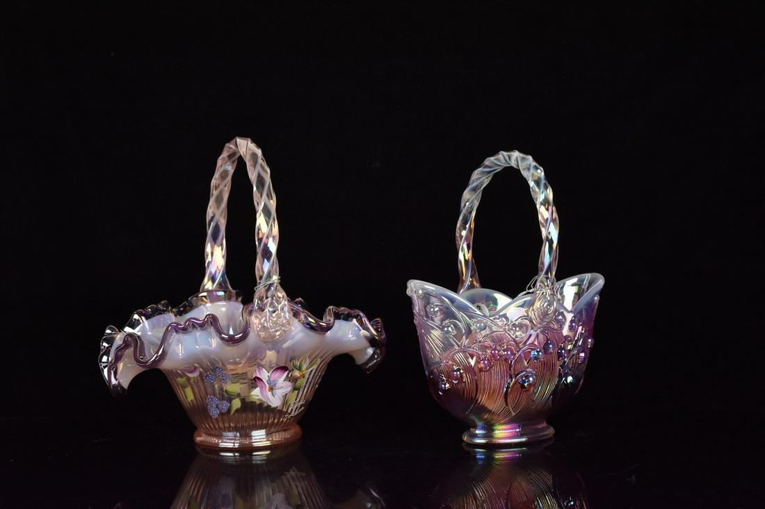 (2) Fenton Baskets: (1) 8.25" Fenton basket. Candy ribbon edge, with lilac crest. Hand painted floral. Excellent condition with tags. (1) 8" Lilly of the valley basket. Iridescent lilac glass to a lily of the valley colo