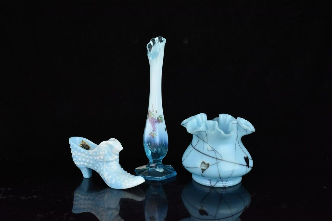 (3) Fenton Light Blue: (1) 9.5" Fenton light blue bud vase. With crested opalescent glaze an light blue crest at the top. Hand painted with grapes. Excellent condition with tags, signed, stamped base. (1) 4.5" Light blue "H