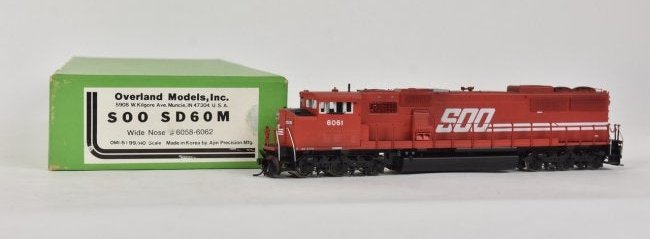 Overland Models by AJIN (Korea) Diesel Engine: An HO scale Soo SD60M Wide Nose diesel engine #6058-6062; Overland Models by AJIN (Korea) in original packaging. Light shelf wear to packaging. Please Note: Scheerer McCulloch Auctioneer will add ship
