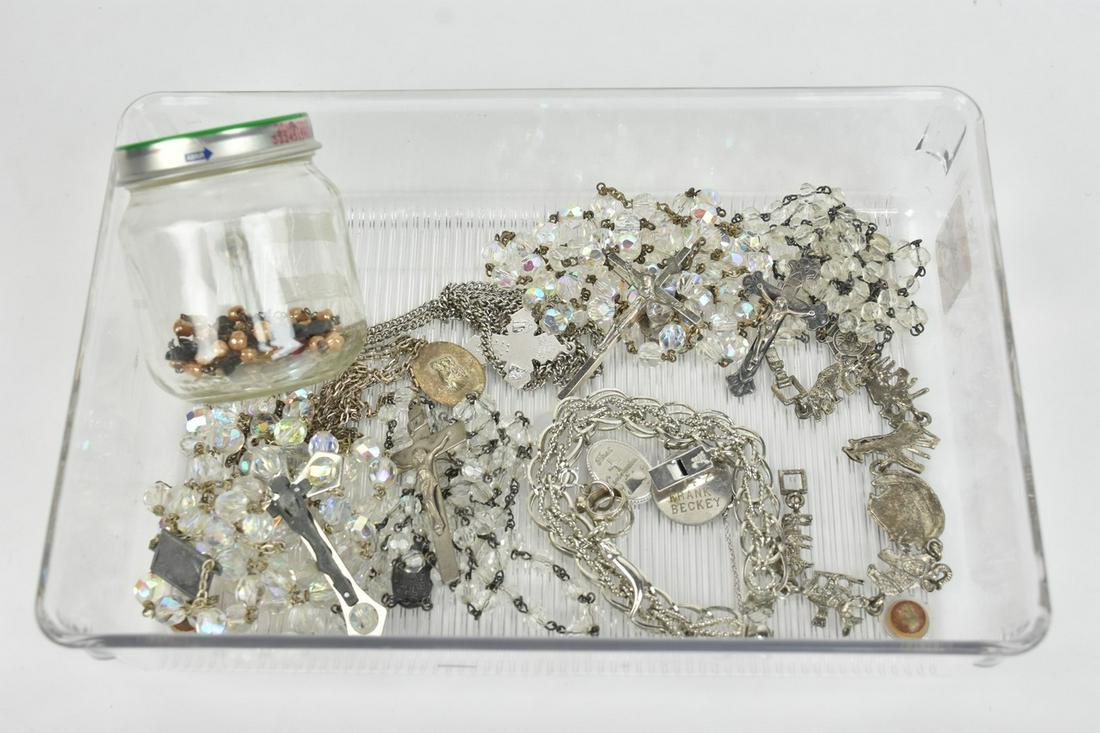 (4) Glass Bead Rosaries, Sterling Bracelet, and Me: (4) Glass bead rosaries, 2-sterling cross and plaque, 2-unmarked silver tone metal, (1) Sterling silver charm bracelet with (5) sterling charms, total weight 1.05 ozt, (2) sterling pendants on chain,