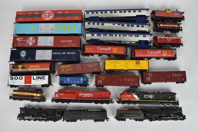 Over 20 HO Scale Train Cars: A collection of over 20 HO scale plastic train cars; most unmarked. Condition varies- some are missing wheels/couplers; surface scratches; loss of paint; all untested. Please Note: Scheerer McCulloch 