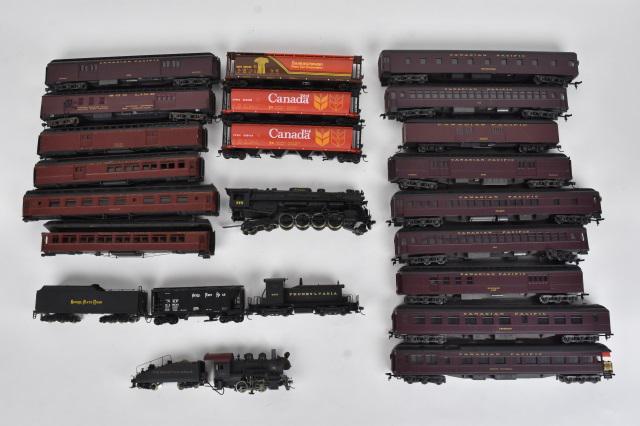 Over 20 HO Scale Train Cars: A collection of over 20 HO scale plastic train cars; most unmarked. A few trains marked Rivarossi. Condition varies- some are missing wheels/couplers; surface scratches; loss of paint; all untested. P