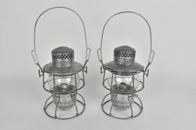 (2) Armspear "1925" PRR Kero Lanterns: A pair of Armspear "1925" kerosene lanterns with clear glass. Embossed "PRR" for Pennsylvania Railroad. Light surface wear consistent with age and use. Please Note: Scheerer McCulloch Auctioneer will 