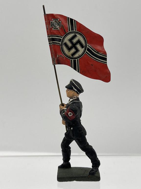 WW II German Toy Soldier RARE SS officer w/Flag: RARE LINEOL TOY SOLDIER -- A German SS officer flag bearer! The German war flag, soldier and base are metal. The base is clearly marked "LINEOL GERMAN." This is a RARE find. See photos.