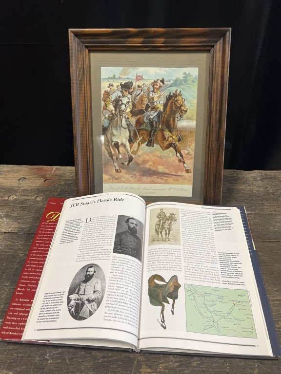 Civil War Print+ Book Gen JEB Stuart: This wood framed colored textured print of the original " H.A. Ogden lithograph depicts Confederate soldiers on horseback, riding away from a burning village in the top left corner. The man leading th
