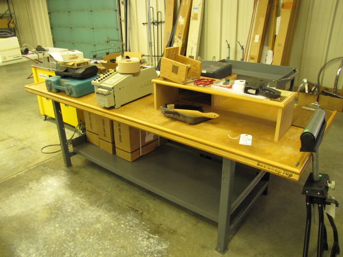 Bay shop top work table: Wood top metal frame work table. 36"deep, 96"wide, and 30.5"high.