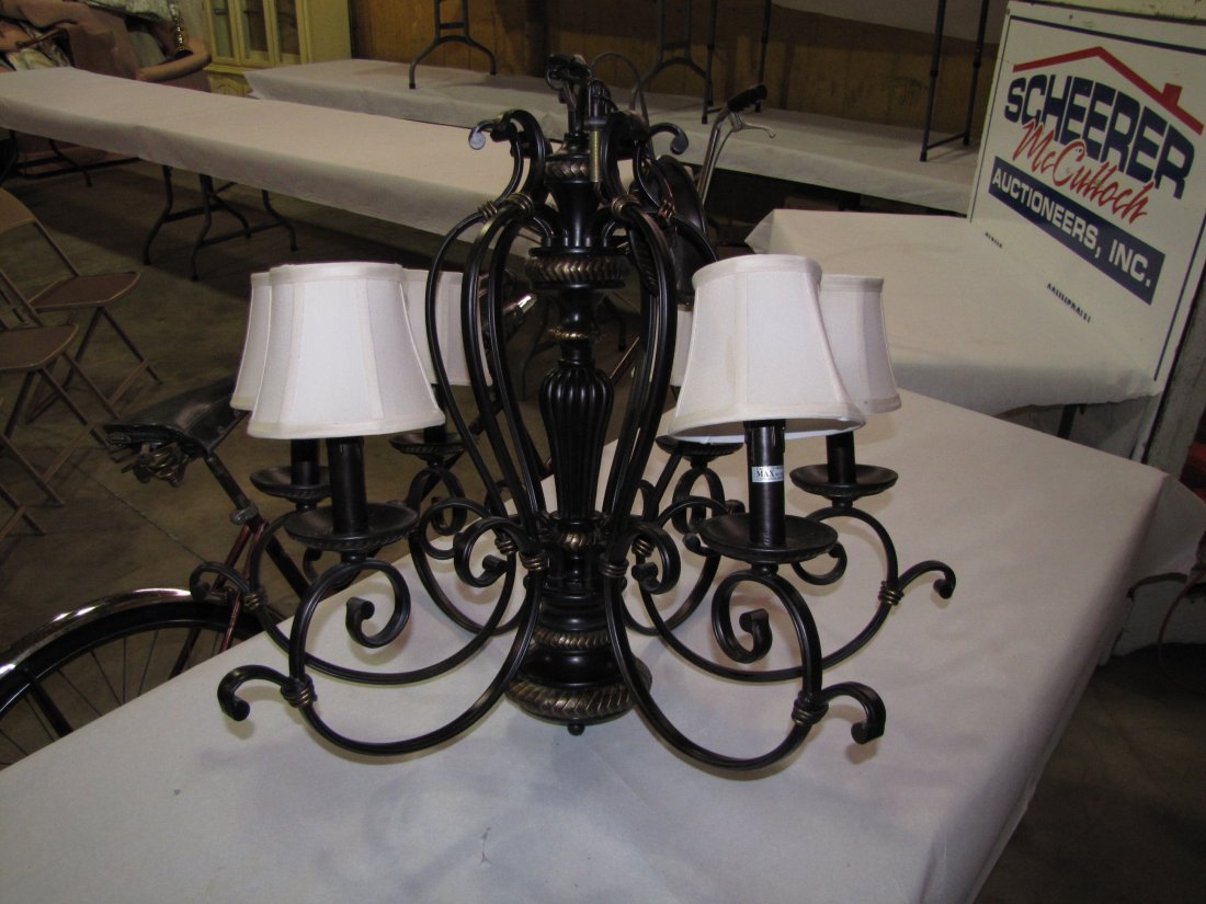 Contemporary 6 light chandelier: 27" high and 31" diameter. Brushed copper finish. Off-white cloth shades.