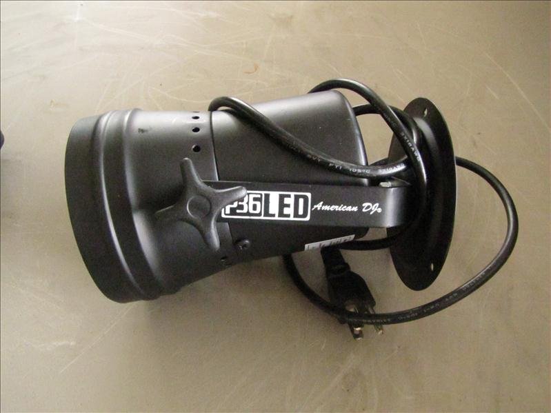 Red green and blue LED stage accent light: Red green and blue LED stage accent light. Model P36LED, 120 v, made by American DJ. Housing is slightly bent at the rim near the lens.