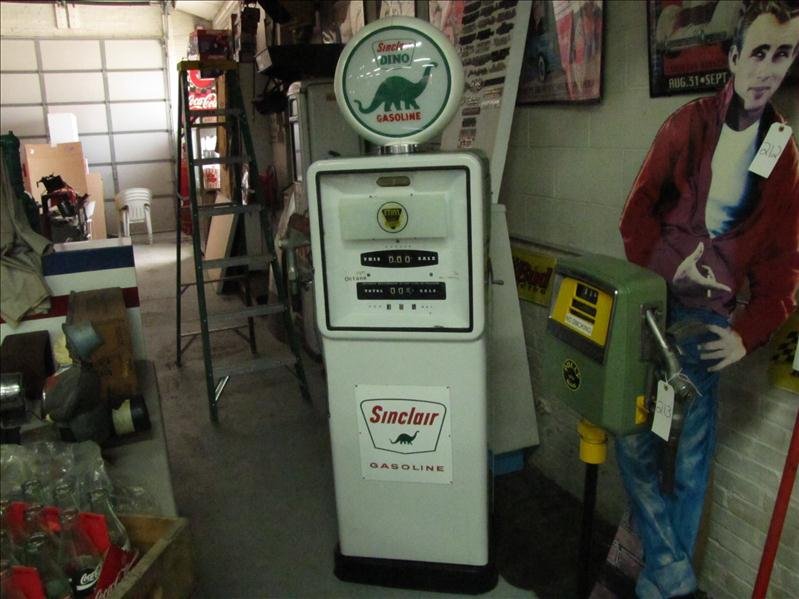 Ethyl Gas Pump with Sinclair Dino Add Ons: Ethyl Fuel Pump with Sinclair Dino Add Ons Single hose pump with large front facing. Gauges include sale & gallons gauges with porcelain background. Glass fill meter tubes. Ethyl fuel pump appears to 