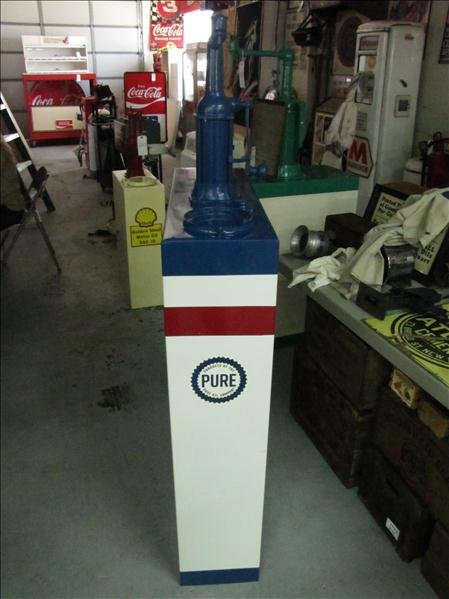 Pure Oil Tank & Pump: Pure Oil Tank & Pump 60 gallon tank. Pump is marked: Model 607 Serial #40519. Used for pumping oils, fuels or lubricants. Missing top cap but has filter screen. Has dip stick. Measures: 64" tall x 10"