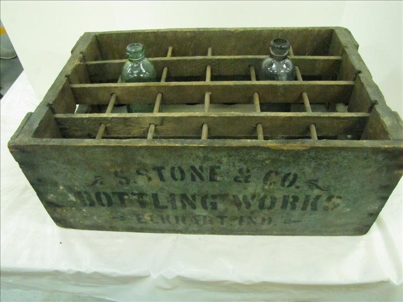 S. Stone & Co Bottling Works Wooden Crate: S. Stone & Co Bottling Works Wooden Crate. S. Stone & Son Bottling Works crate, Elkhart, IN, 470 with slat & dowel partitions. 2 bottles included: Green & Purple Glass Blob Top bottles. Crate measures
